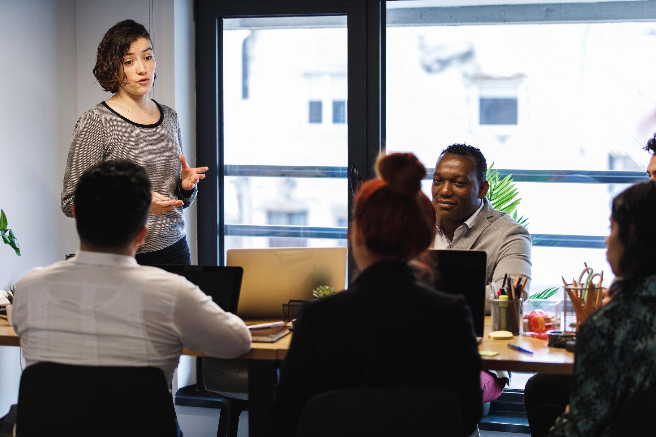 Businesswoman presenting to a diverse team