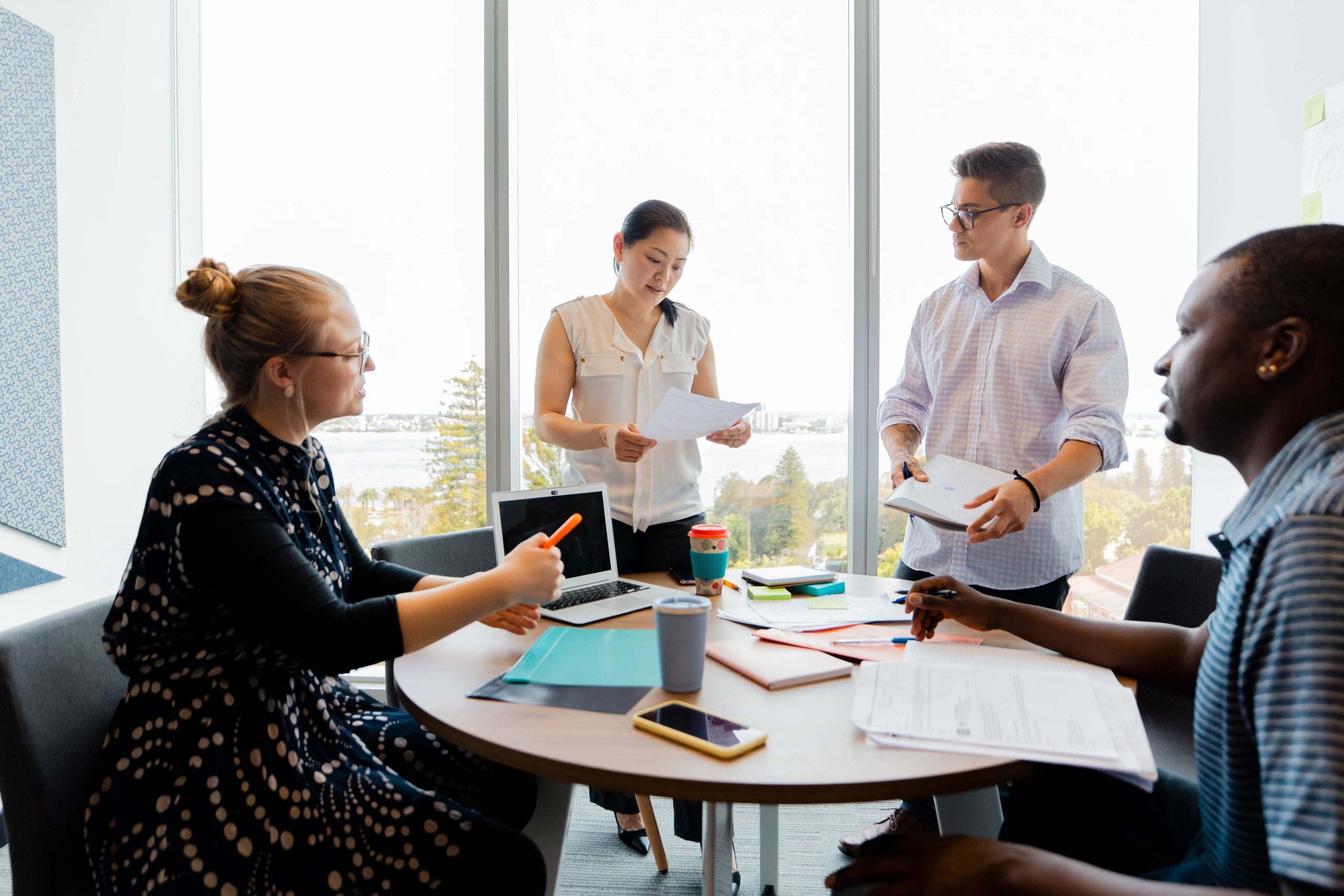 Collaborative professionals meeting around a desk