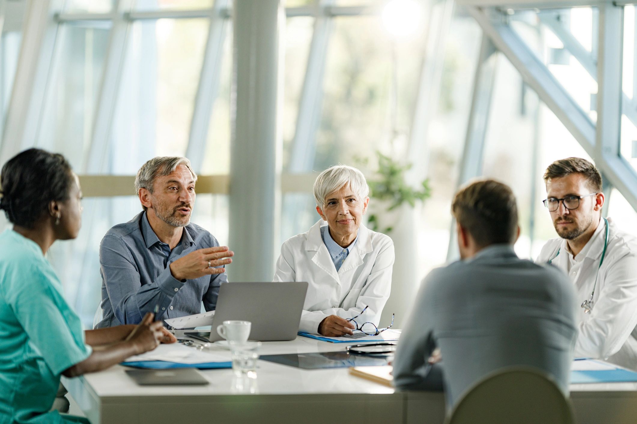 Doctors and business professionals meeting in a medical office