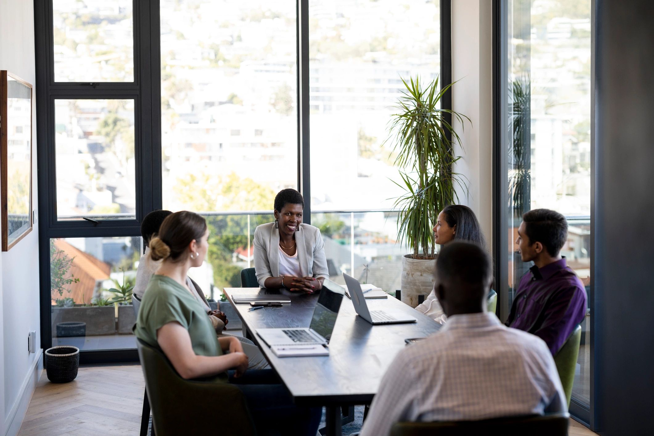 Professional recruitment team meeting in a bright boardroom