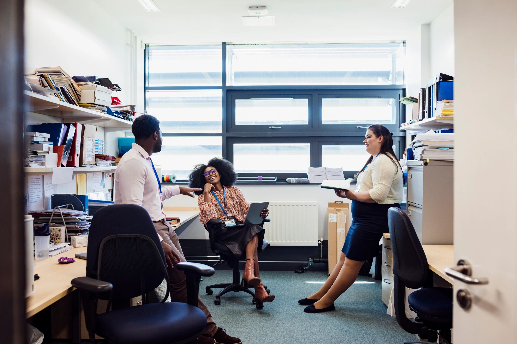 Team members in conversation in an office