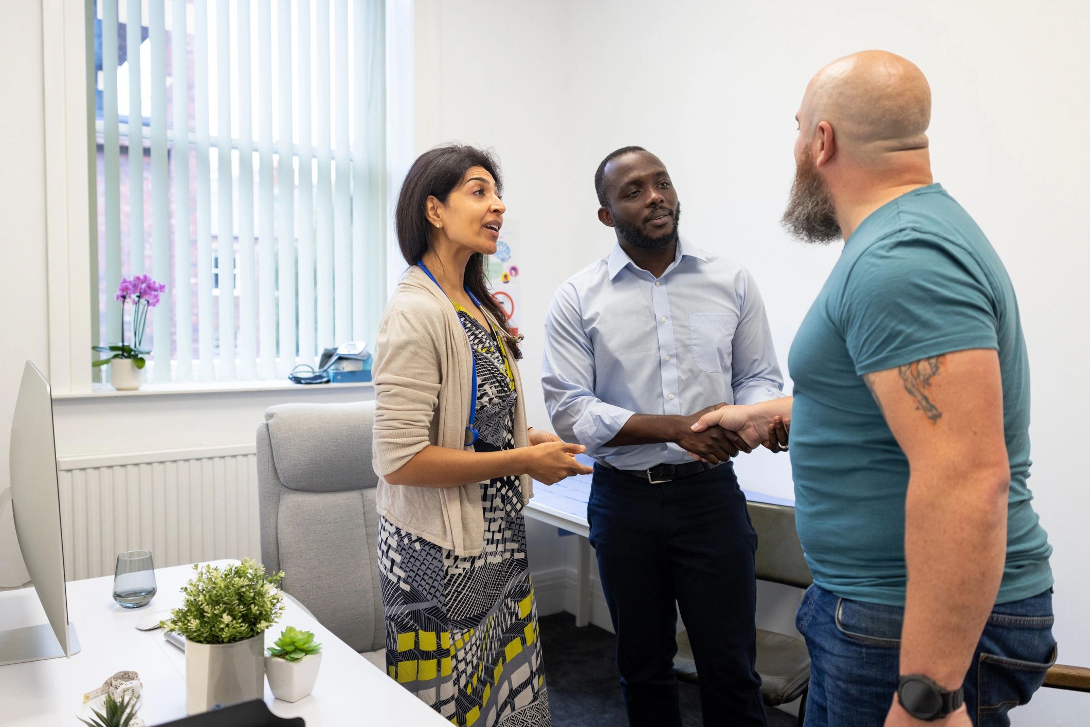 Professional consultation handshake in a healthcare setting
