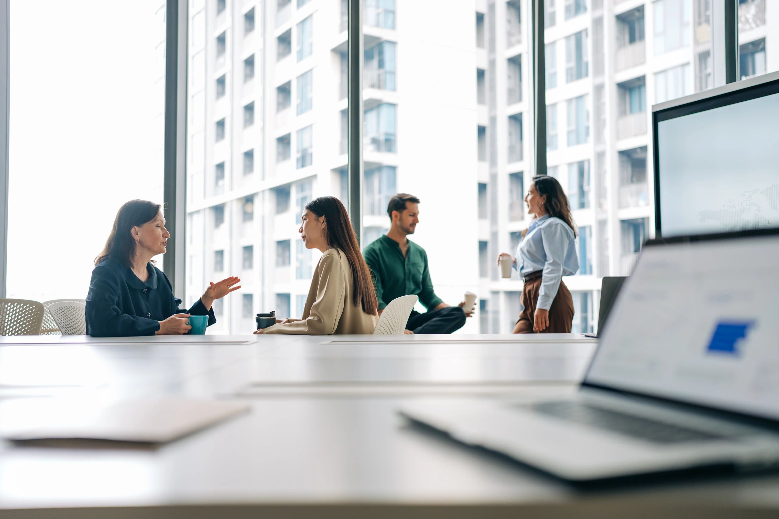 Business colleagues chatting in a conference room
